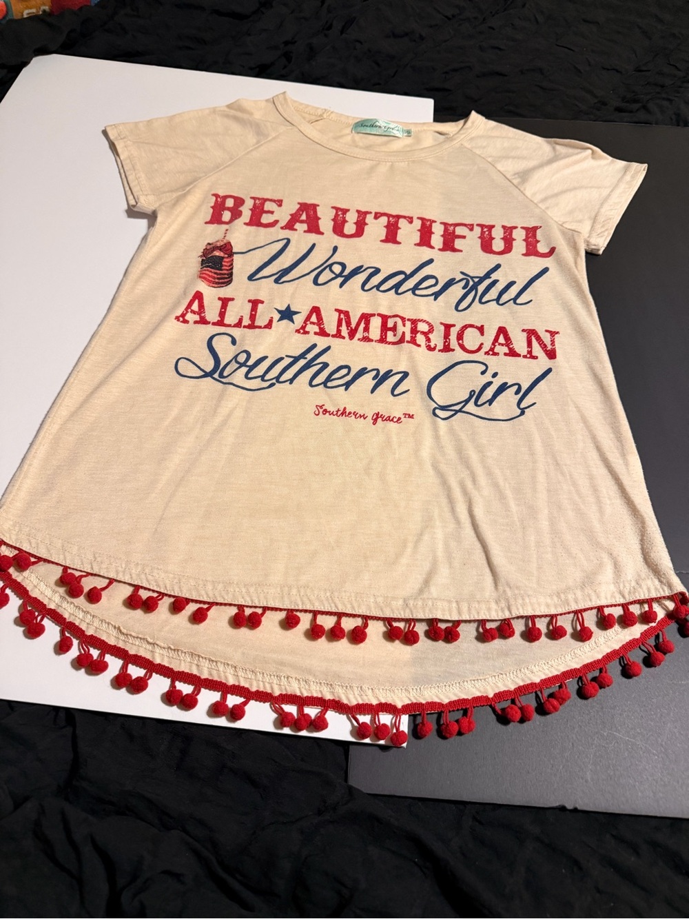 Southern Grace Cream Tee with Red Pom Hem & Patriotic Graphic